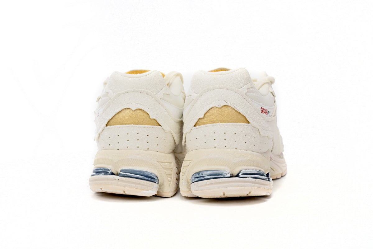New Balance 2002R Women's & Men's Ivory Cream Distressed Retro Sneakers